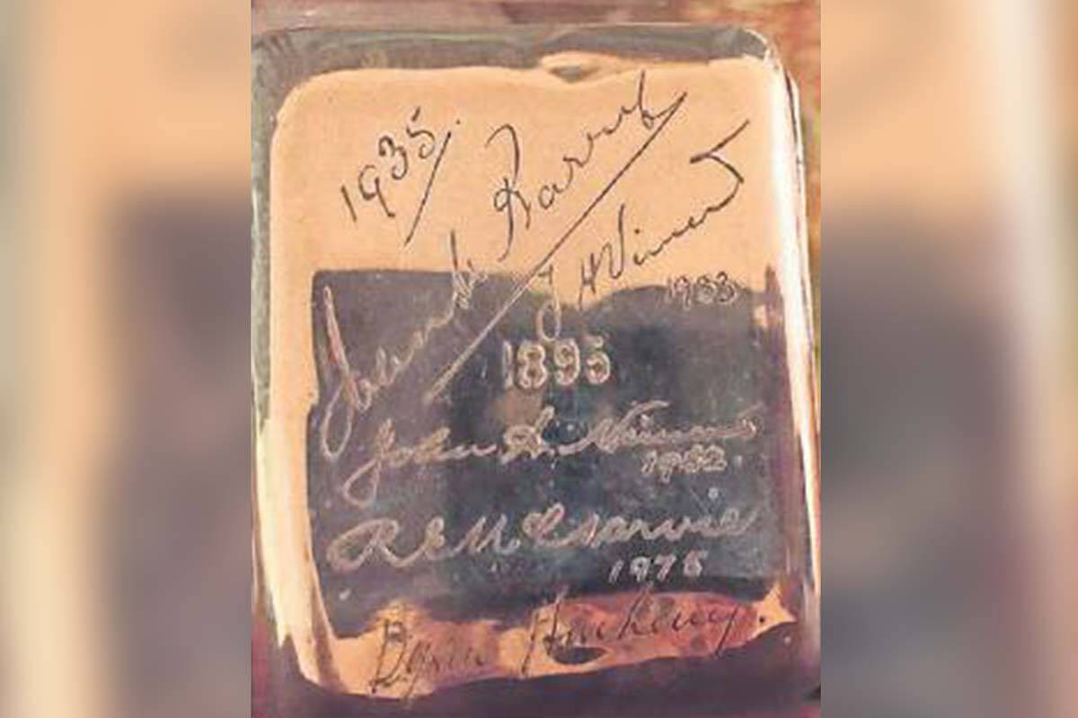 A silver cigarette case with names engraved on it